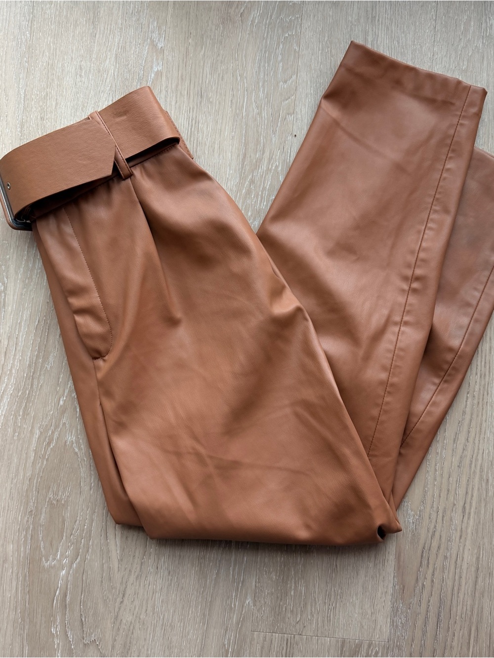 Zara bloggers favorite faux leather pleated front pants with belt